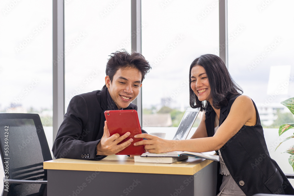 Businessman and businesswoman meeting and working together with tablet. Businessman and businesswoman meeting and working together with tablet.