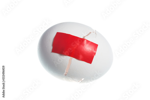 Duct tape on the crack in the egg shell isolated on white background