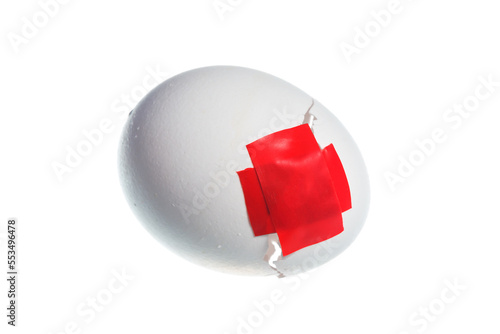 Duct tape on the crack in the egg shell isolated on white background