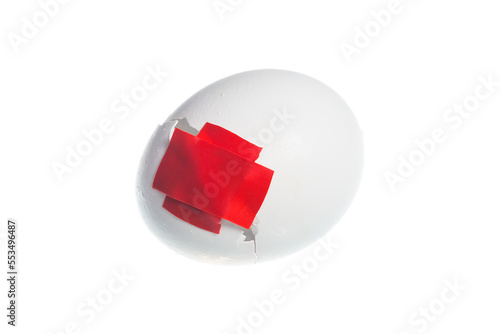 Duct tape on the crack in the egg shell isolated on white background