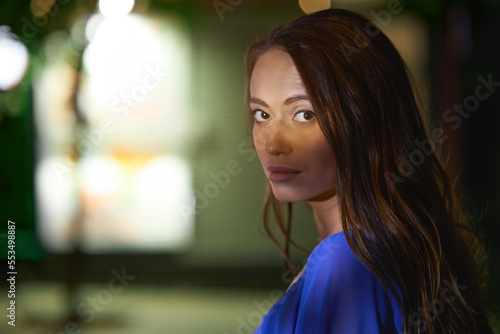 Wallpaper Mural Young woman looking at camera over shoulder Torontodigital.ca