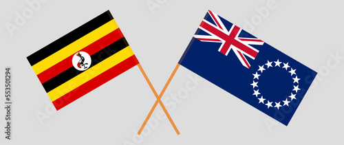 Crossed flags of Uganda and Cook Islands. Official colors. Correct proportion