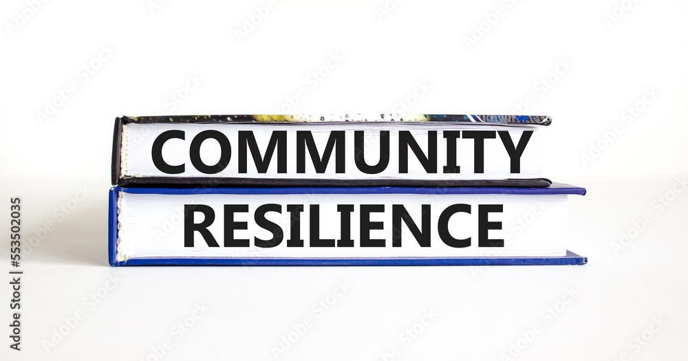 Community resilience symbol. Concept word Community resilience typed on books. Beautiful white table white background. Business and community resilience concept. Copy space.