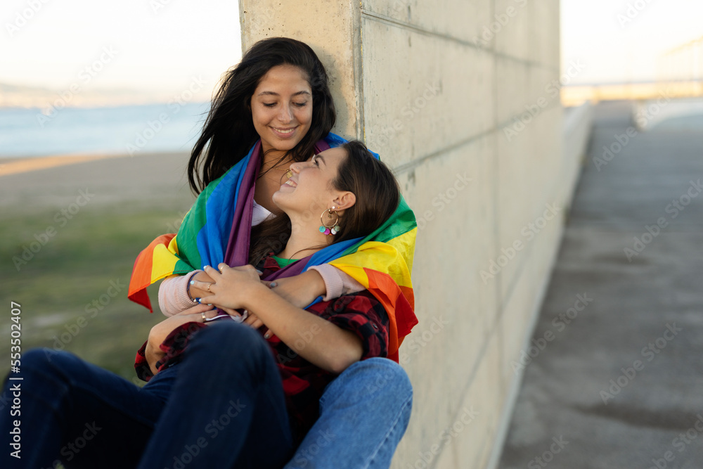 Beautiful lesbian young couple embraces. Two girls enjoy outside Beautiful lesbian young couple embraces. Two girls enjoy outside