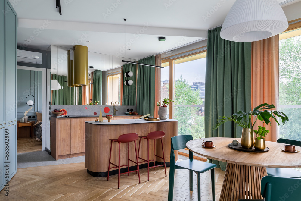 Interior design of harmonized dining room with kitchen, round