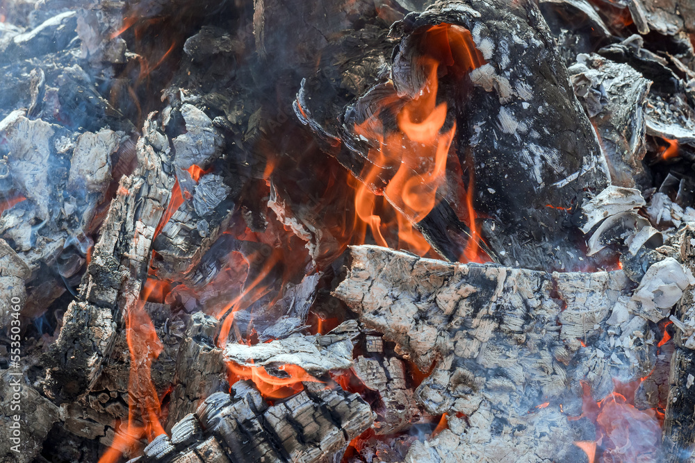 Ash embers of bonfire after fire has been burned wood prepared for BBQ cooking