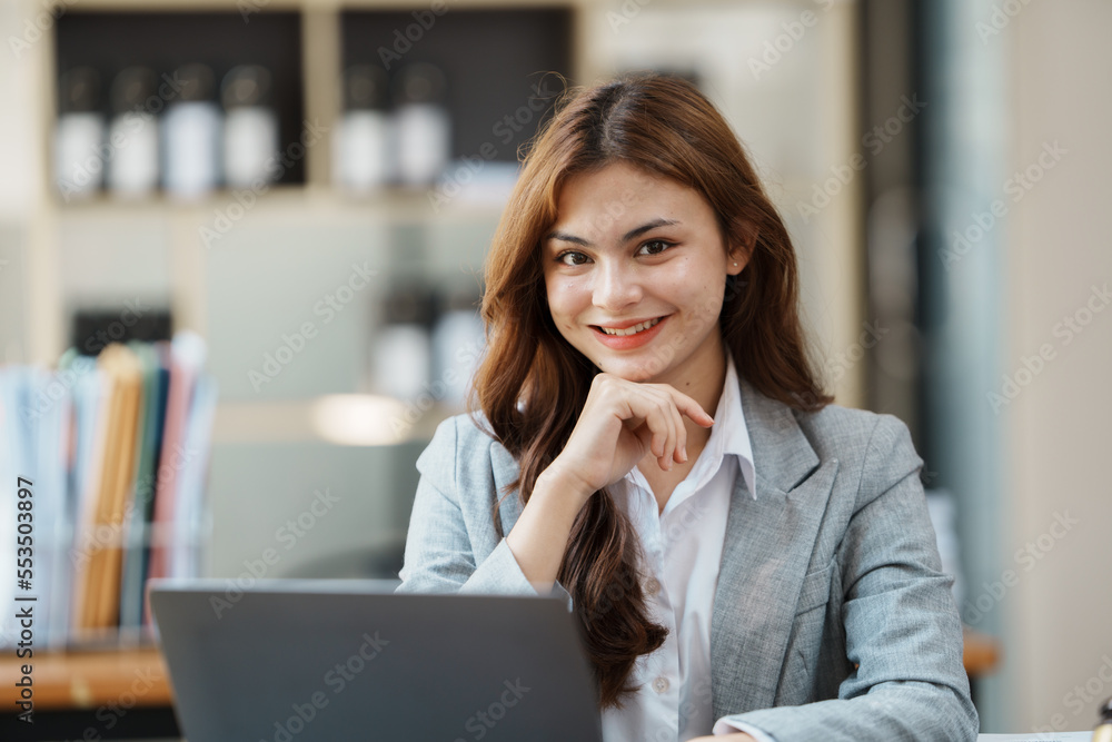 Asian business woman looking smart working of office. Asian business woman looking smart working of office.