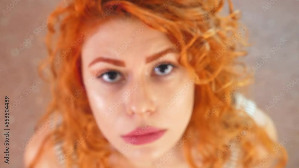 shot from above of young depressed woman staring at camera shot from above of young depressed woman staring at camera