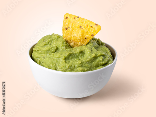 bowl with guacamole and nachos
