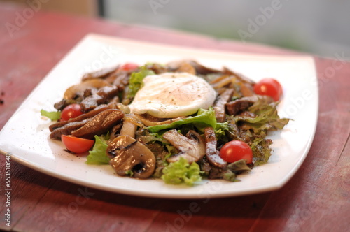 restaurant dish for the holidays, salad with poached egg