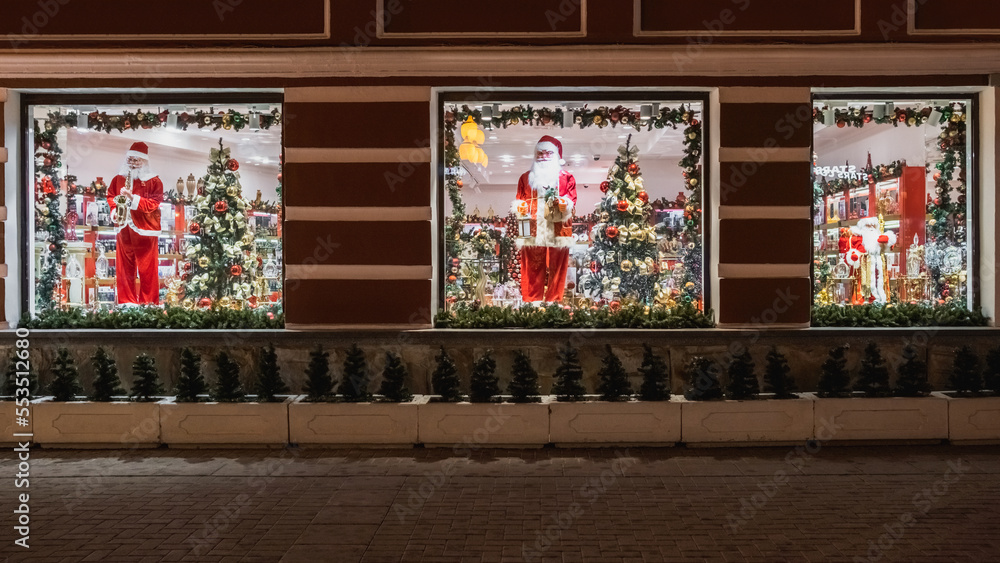 Christmas shop window with Santa Claus and Christmas tree