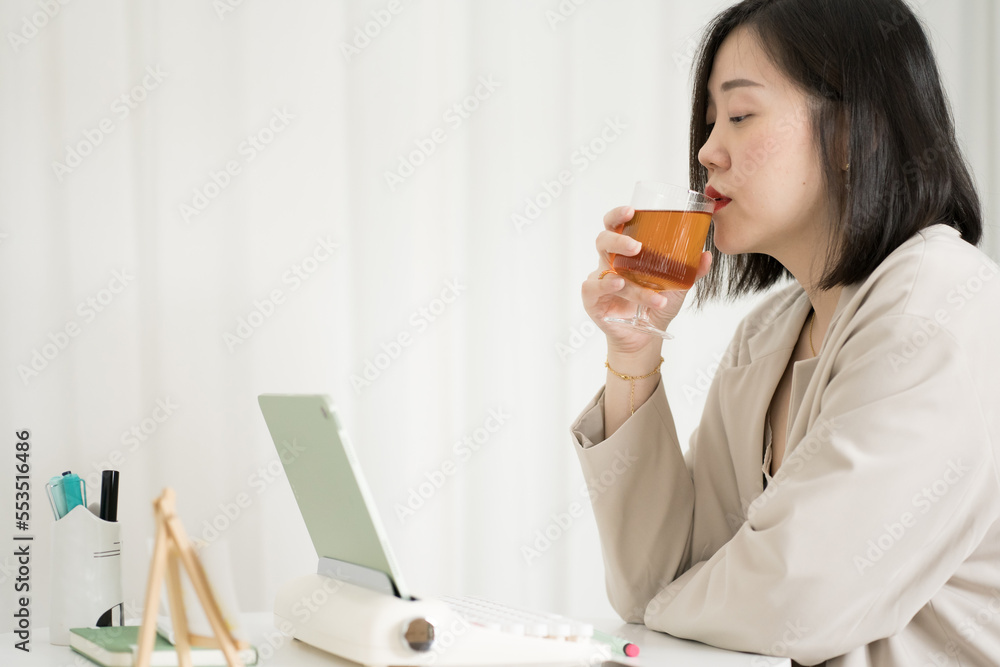 asian business and writer woman meeting online and typing by use retro keyboard and tablet asian business and writer woman meeting online and typing by use retro keyboard and tablet