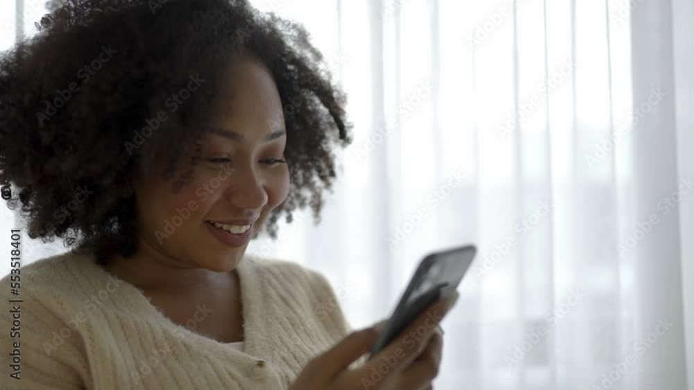 African American black woman smile use tablet smartphone in winter sweater work home, Portrait beauty girl hygge relax on chair. Technology people connection digital online social media market African American black woman smile use tablet smartphone in winter sweater work home, Portrait beauty girl hygge relax on chair. Technology people connection digital online social media market