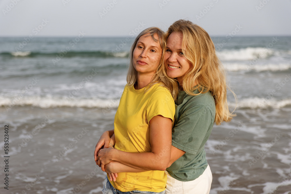 Girlfriends walk and have fun at the sea, family vacation at sea Girlfriends walk and have fun at the sea, family vacation at sea