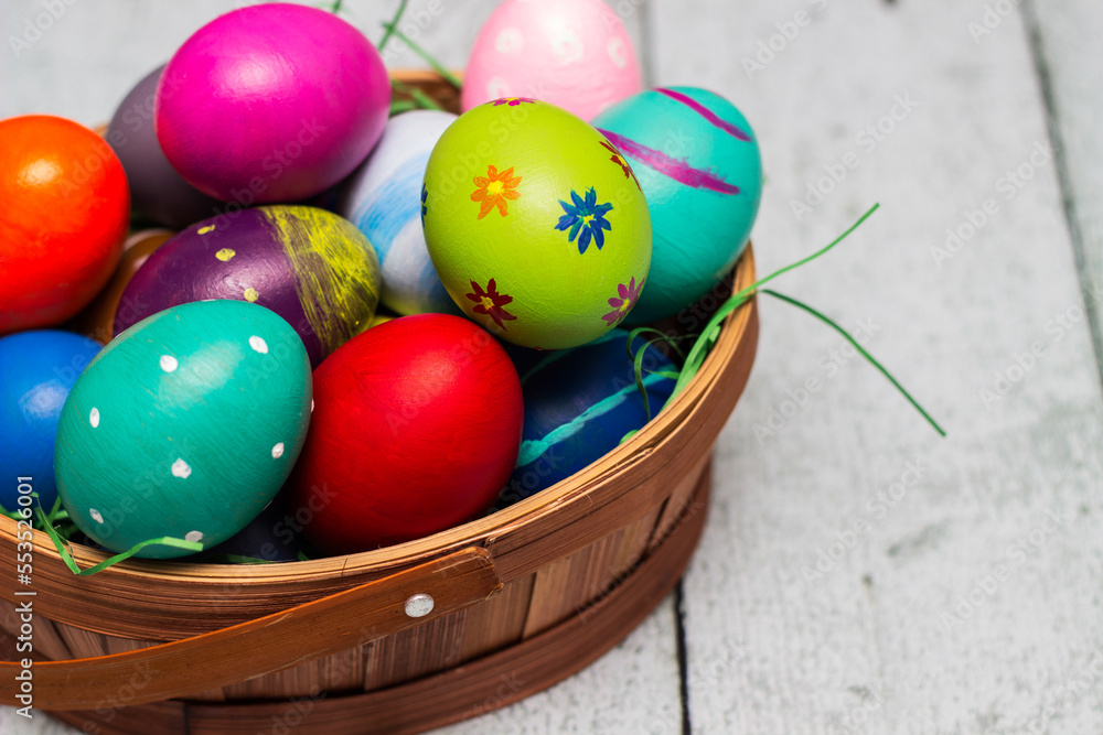 Basket with painted colorful easter eggs Basket with painted colorful easter eggs