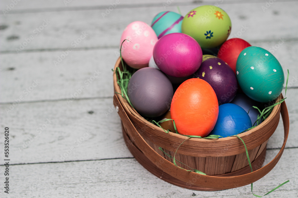 Basket with painted colorful easter eggs Basket with painted colorful easter eggs