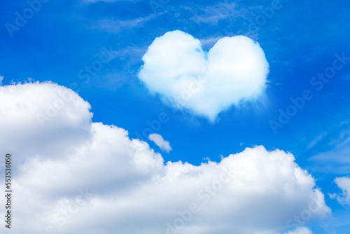 clouds on blue sky with heart shaped cloud