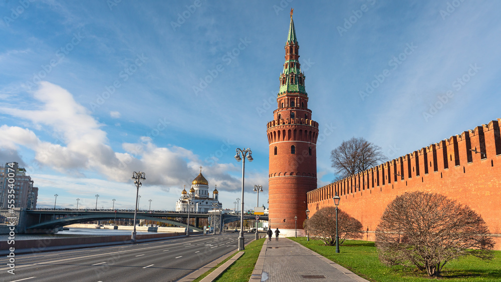 Obraz premium Vodovzvodnaya tower of the Moscow Kremlin with the Church of the Nativity in the background. Moscow, Russia. Architecture and sights of the Russian capital