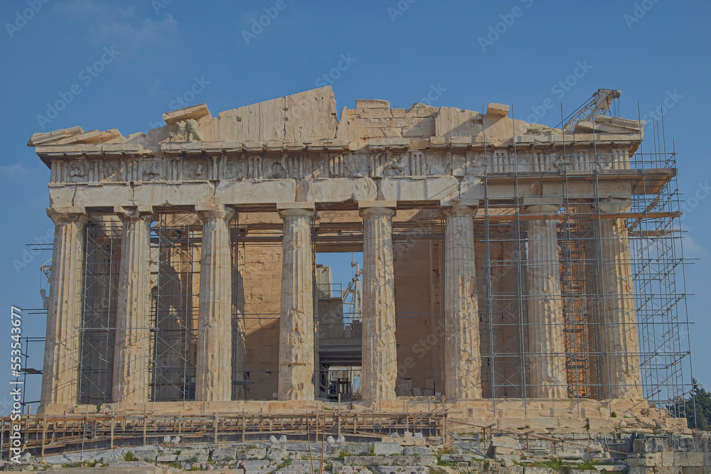 The western main front of Parthenon ancient temple under a clear blue sky as a background. A visit to Acropolis of Athens, Greece. The western main front of Parthenon ancient temple under a clear blue sky as a background. A visit to Acropolis of Athens, Greece.