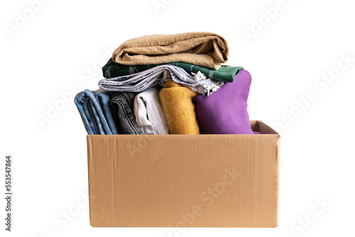 Woman packs clothes in boxes for donating.