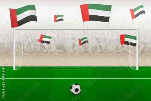 United Arab Emirates football team fans with flags of United Arab Emirates cheering on stadium, penalty kick concept in a soccer match.