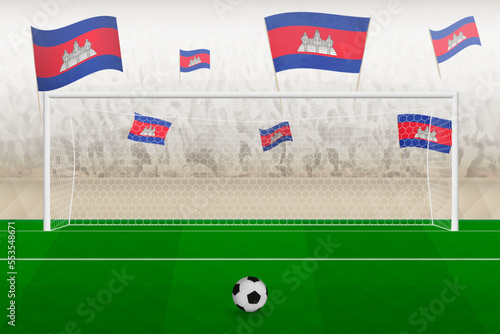 Cambodia football team fans with flags of Cambodia cheering on stadium, penalty kick concept in a soccer match.