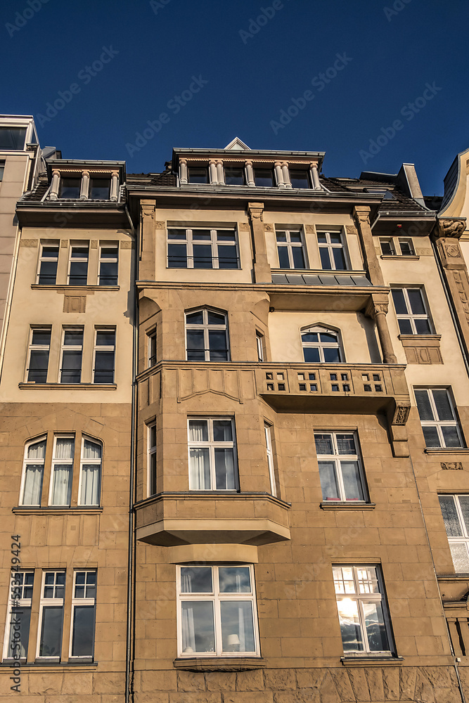 Fototapeta premium Beautiful traditional medieval buildings along the picturesque river Rhine promenade at sunset. DUSSELDORF, GERMANY.