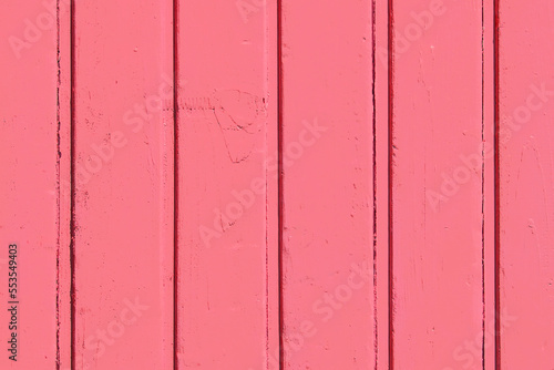 Vertical boards in light red crimson color paint wooden surface texture plank background