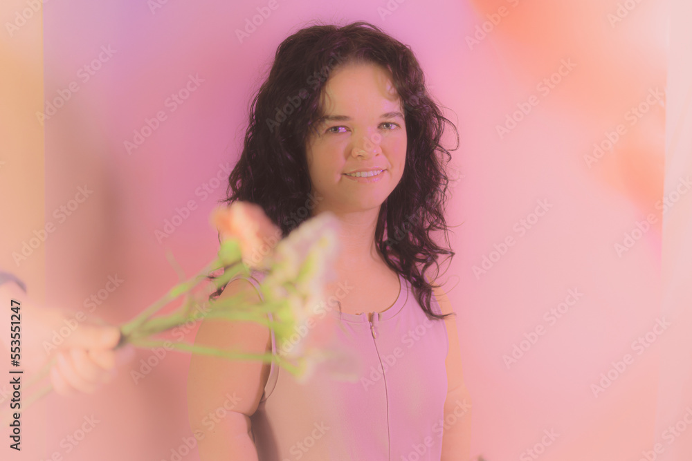 Fototapeta premium Woman posing with flowers