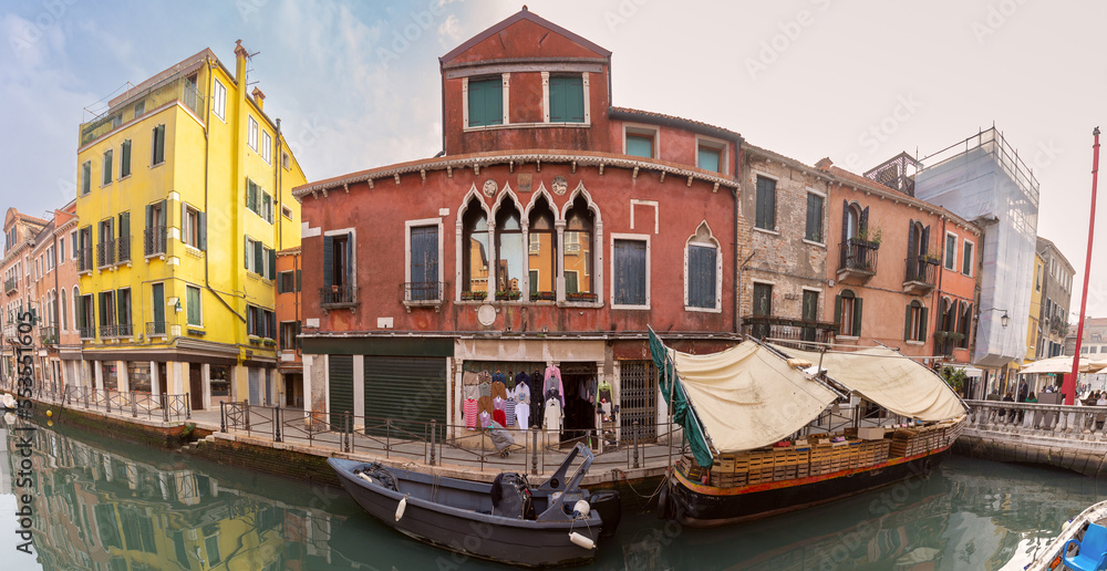 Panorama of old traditional Venetian houses along the canal.