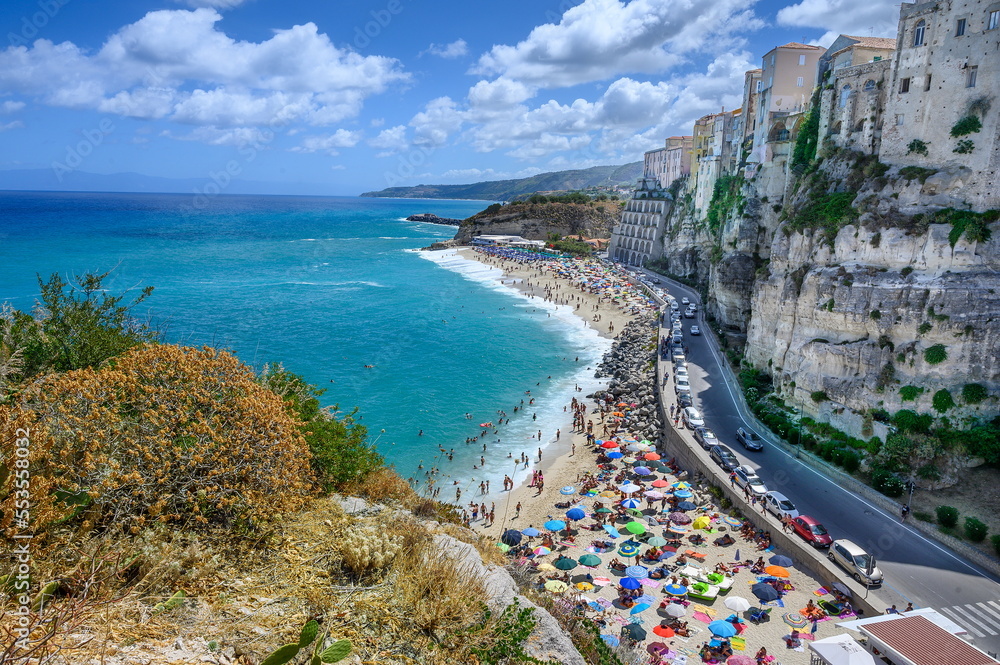 People enjoying a summer day on the famous beach of Tropea (Cala