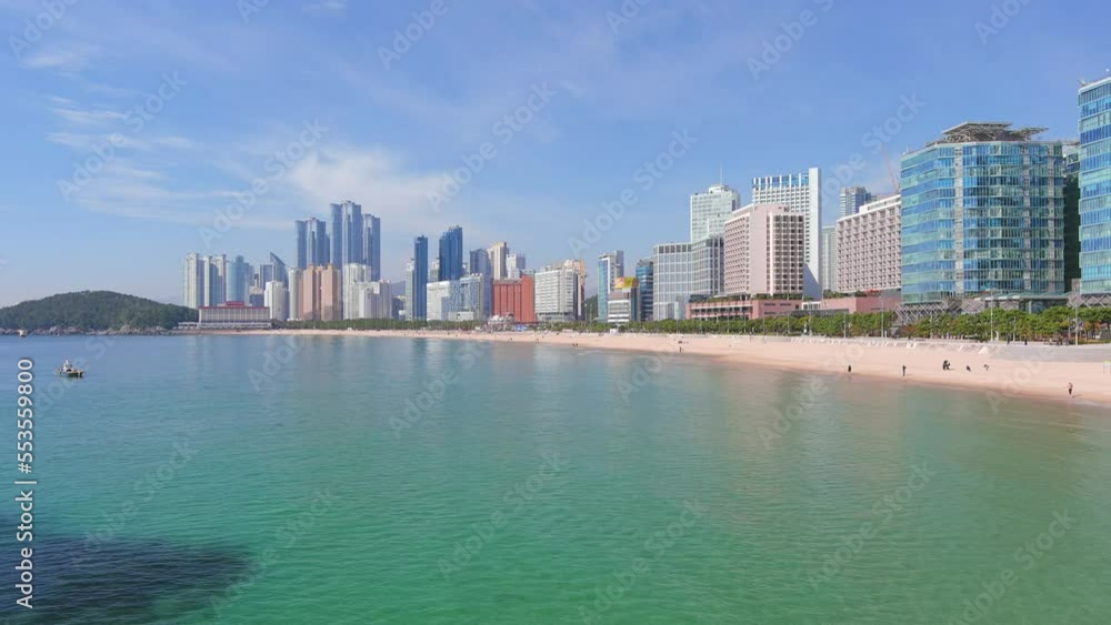 Busan: Aerial view of city in South Korea, skyline with modern high-rise buildings (skyscrapers) and Haeundae Beach, sunny day with blue sky - landscape panorama of Eastern Asia from above Busan: Aerial view of city in South Korea, skyline with modern high-rise buildings (skyscrapers) and Haeundae Beach, sunny day with blue sky - landscape panorama of Eastern Asia from above