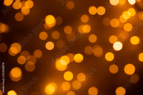 Abstract bokeh background - gold  orange  light blurred glitter lights - 