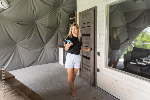woman with smartphone at home Free Download woman with smartphone at home - GFXLoad