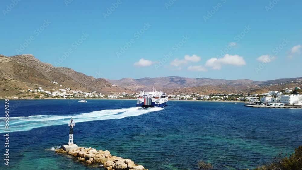 View of the Harbor of Ios. Passenger ferry departing harbor. 