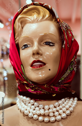 Картината върху платно blues eyes mannequin with hair in blond with a headscarf and pearl neckless with