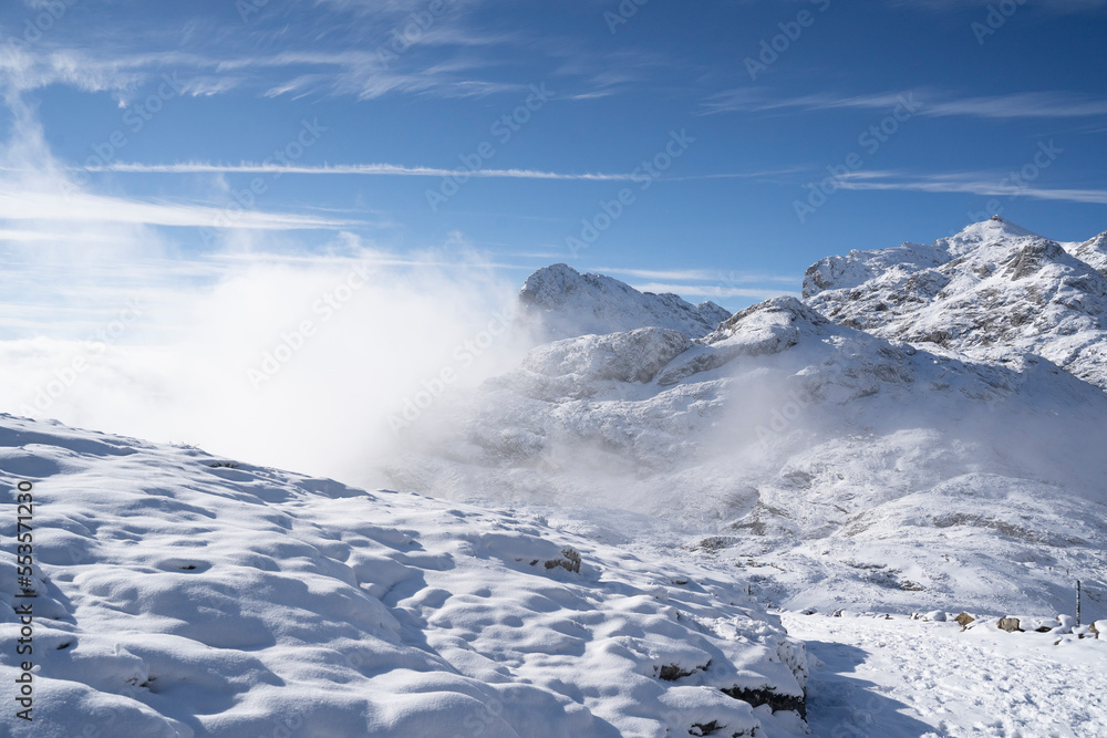 high mountains covered in snow in Picos de Europa National Park, Spain