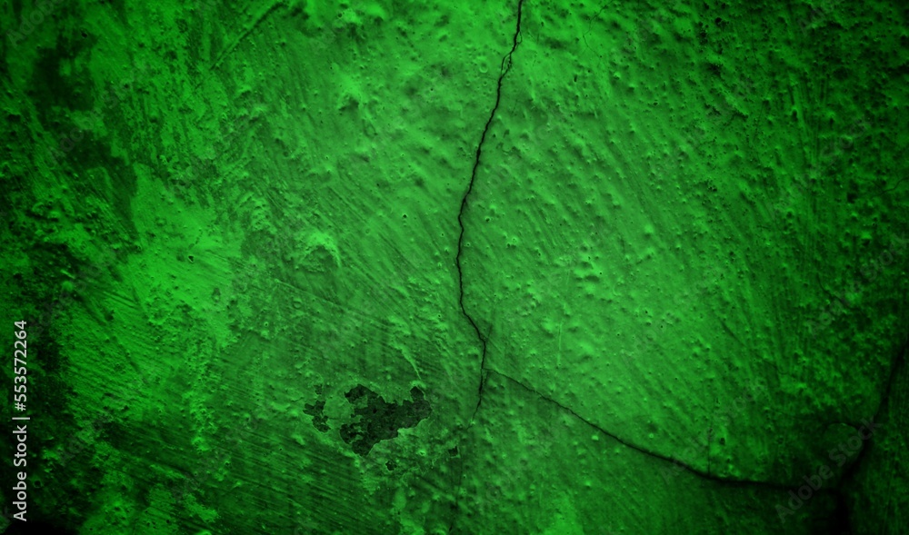 green textured wall background with dark side, purple granite stone