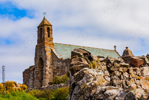 A view of the exterior and bell tower of the Lindisfarne Priory on Holy Island: Northumberland, England photo