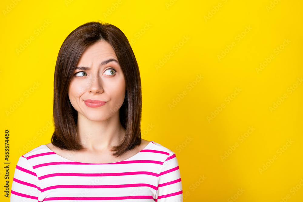 Fototapeta premium Closeup photo of young attractive beautiful woman play eyebrow looking empty space distrust isolated on yellow color background