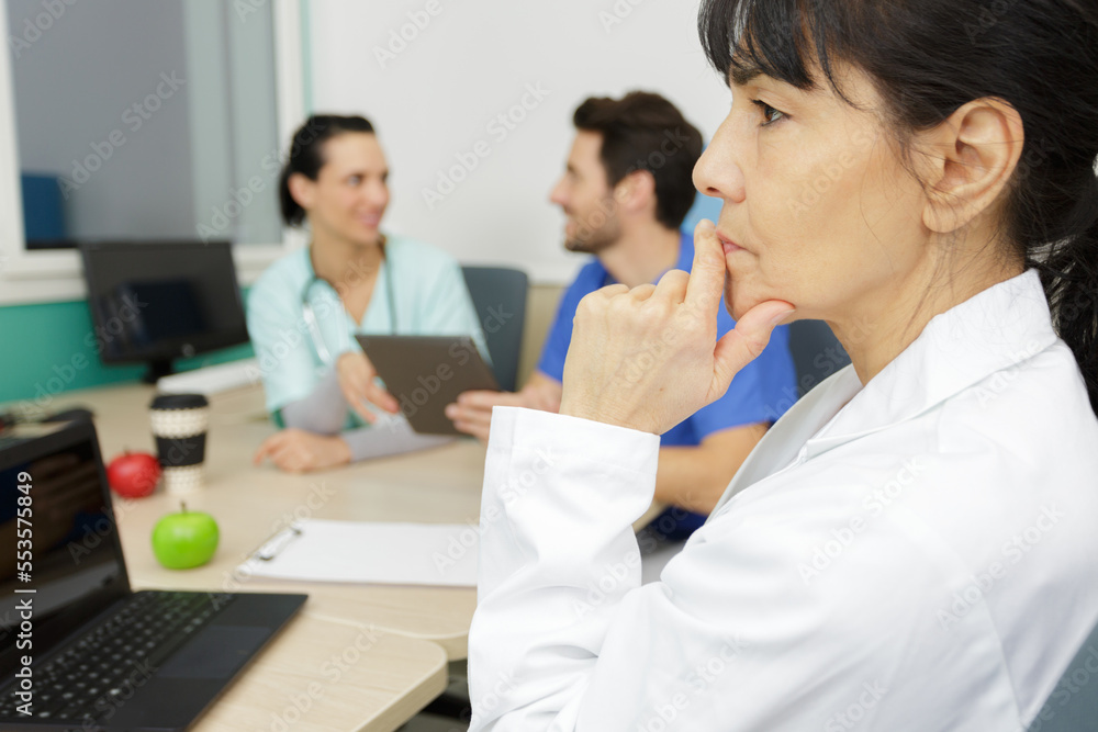 middle age senior nurse doctor woman thinking looking tired