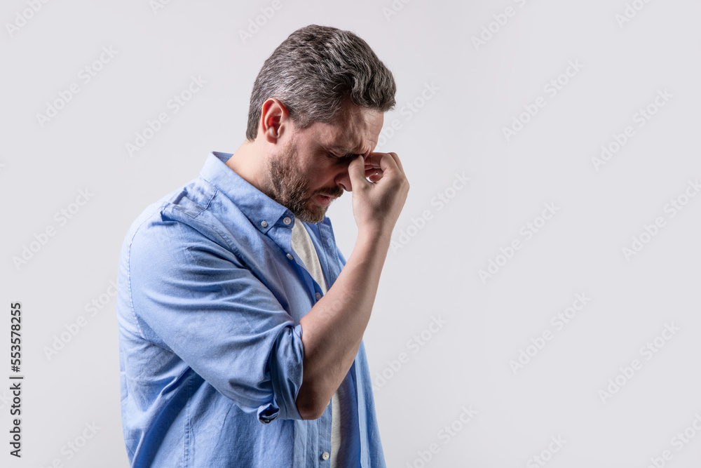 mature man with headache and migraine in studio with copy space. photo of man with migraine mature man with headache and migraine in studio with copy space. photo of man with migraine