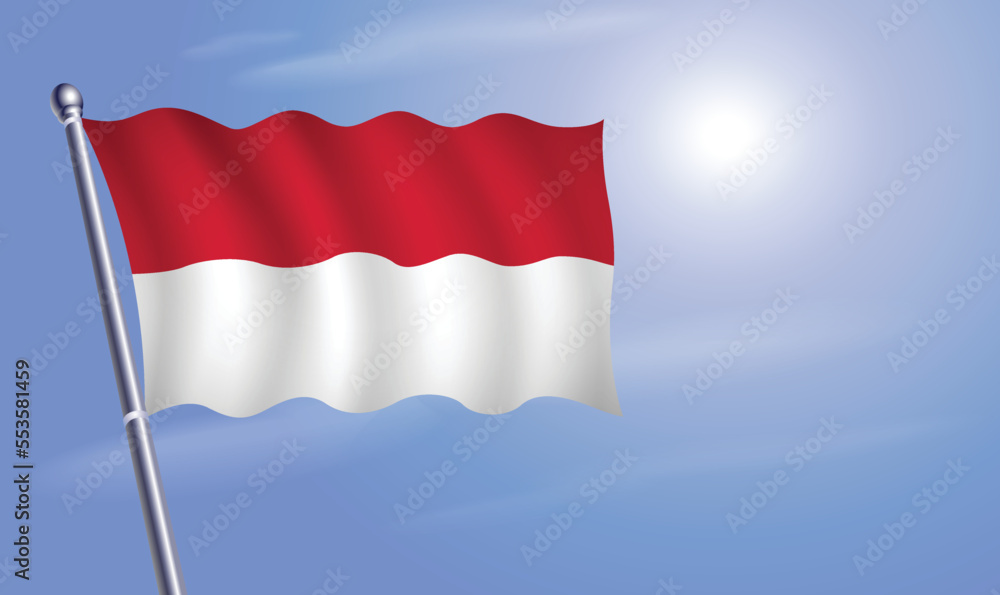 Monaco flag against a blue sky Monaco flag against a blue sky