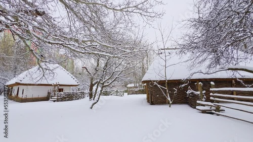 Panorama of snowy street of Mamajeva Sloboda Cossack Village, Kyiv, Ukraine photo