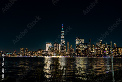 New York - Manhattan at night. Skyscrapers of a large metropolis. Night city at long exposure. Towers in the big city.
