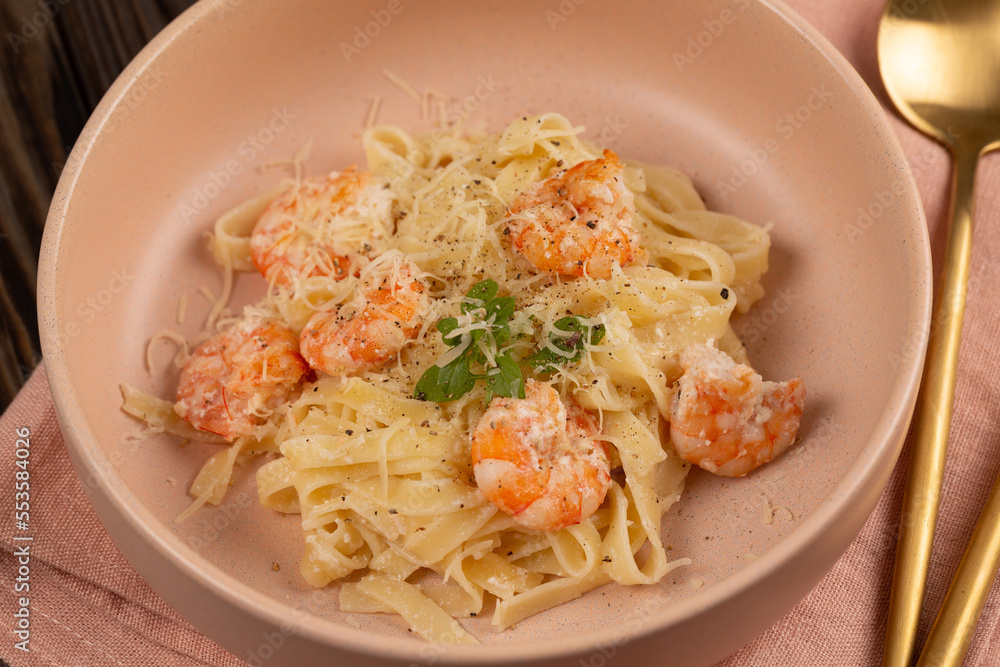 Pasta al dente with shrimp in cream sauce with cheese Pasta al dente with shrimp in cream sauce with cheese
