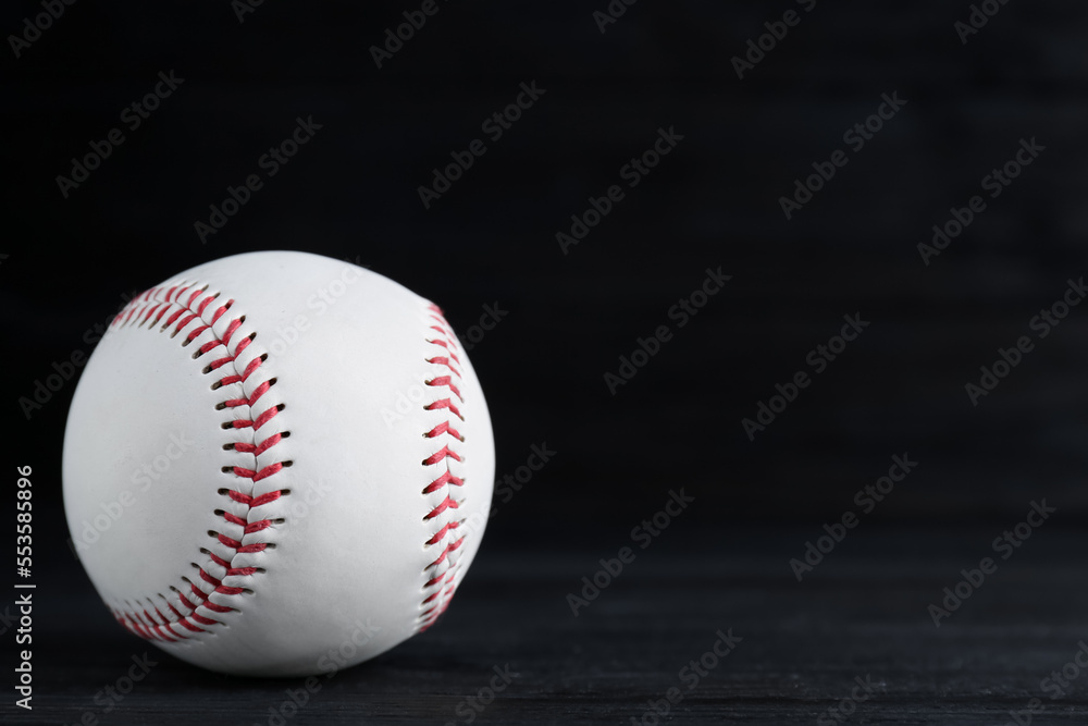 Baseball ball on black background, space for text. Sports game Baseball ball on black background, space for text. Sports game