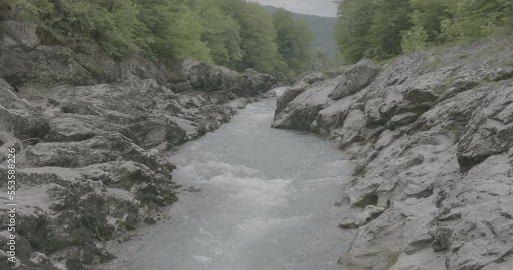 Aerial view of Mountain river and road. Flying over a mountain gorge. Slow motion 120 fps, ProRes 422, 10 bit ungraded DJI D-LOG video Aerial view of Mountain river and road. Flying over a mountain gorge. Slow motion 120 fps, ProRes 422, 10 bit ungraded DJI D-LOG video