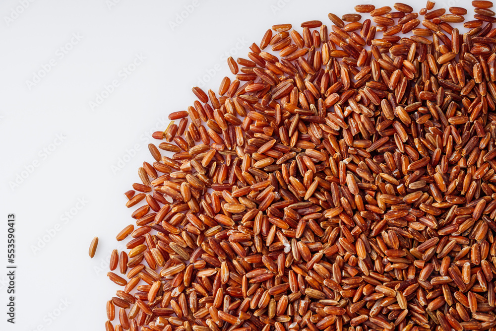 raw fresh red rice on a white background raw fresh red rice on a white background