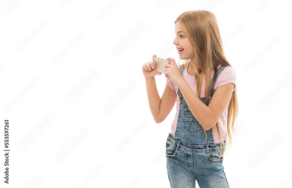 positive teen girl blogger with phone isolated on white background. blogger teen girl in studio positive teen girl blogger with phone isolated on white background. blogger teen girl in studio